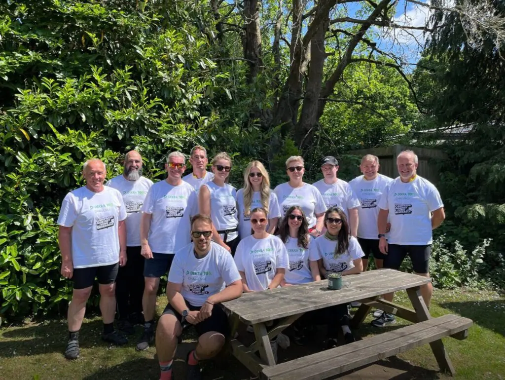 Mark Goodship celebrating with the team after completing DEKRA 100K Challenge for CALM Charity