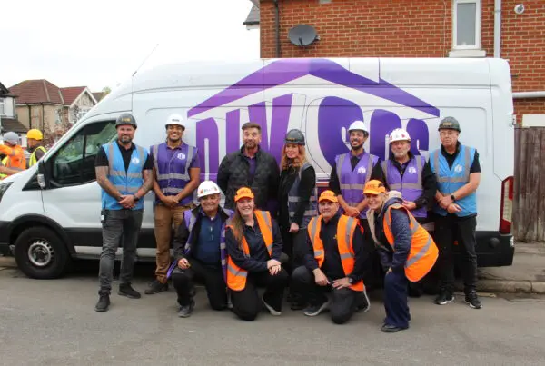 Julie, Libbie, and Ian from Storage on Site with the 'purples' from DIY SOS, including Nick Knowles