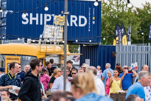 People enjoying street food and music at Southampton Boat Show 2023 Shipyard area.