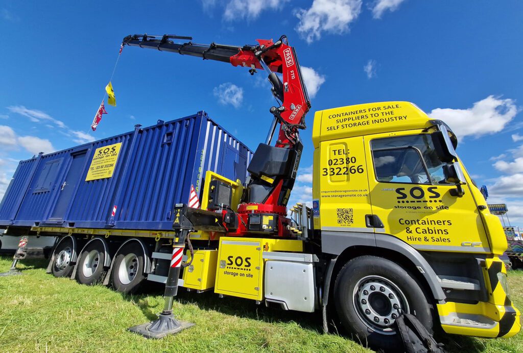 Storage on Site crane-assisted truck with a 20ft shipping container at the Netley Marsh Steam & Craft Show.