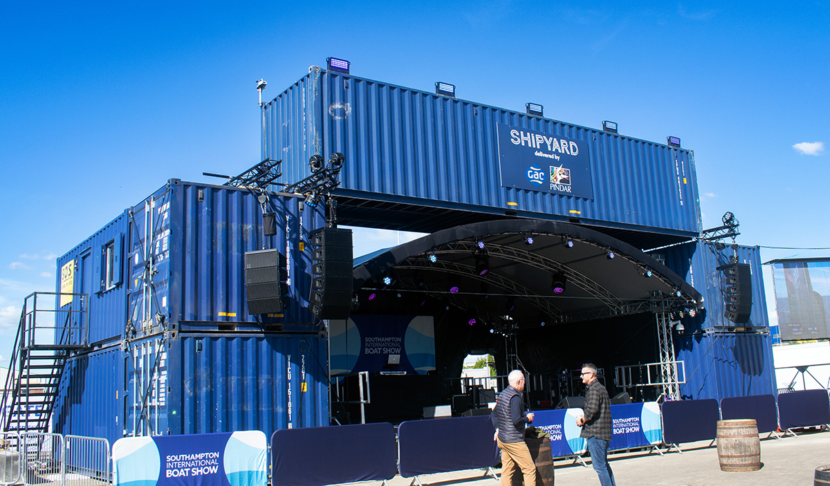 The Shipyard stage with stacked shipping containers as a backdrop at Southampton Boat Show 2024.