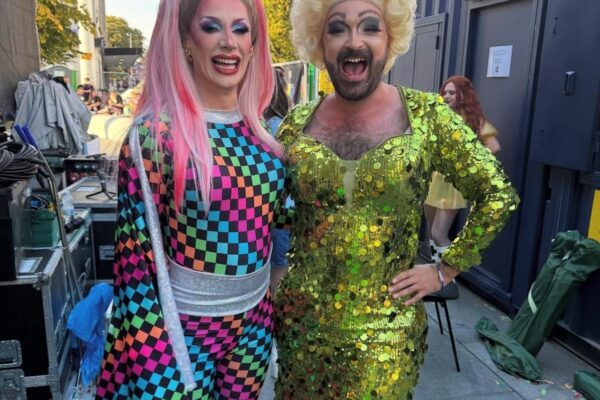Divina De Campo and Dawn The Drag Queen pictured outside Storage on Site cabins at Southampton Pride
