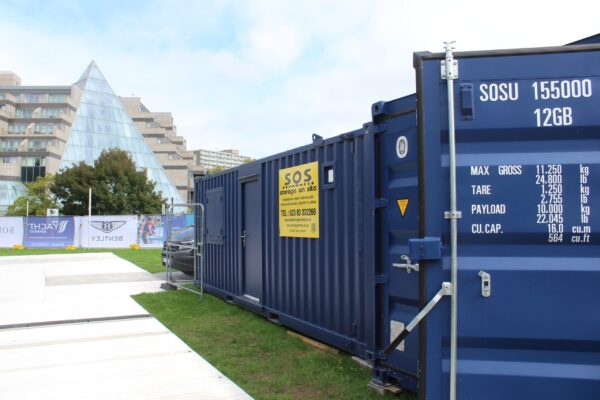 Storage on Site Site Cabins and Shipping Container at Southampton Boat Show with Backdrop of Leonardo Royal Hotel Southampton Grand Harbour