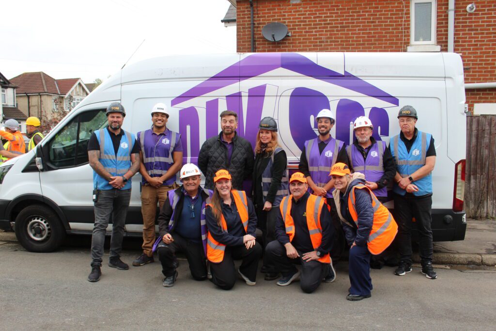 Julie, Libbie, and Ian from Storage on Site with the 'purples' from DIY SOS, including Nick Knowles