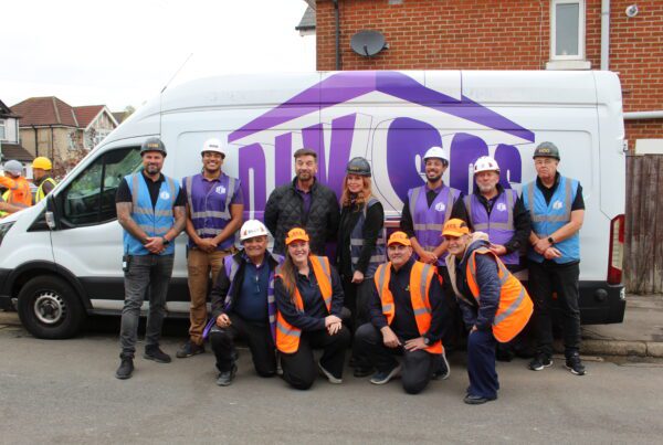 Julie, Libbie, and Ian from Storage on Site with the 'purples' from DIY SOS, including Nick Knowles