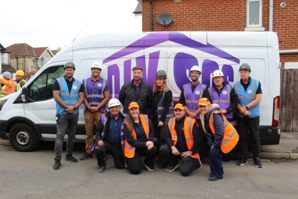 Julie, Libbie, and Ian from Storage on Site with the 'purples' from DIY SOS, including Nick Knowles