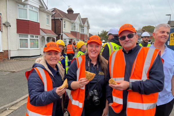 Julie, Libbie and Ian enjoying homemade samosas from the family members of the DIY SOS home.