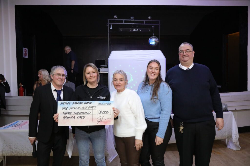 Amy, Founder of George's Rockstars charity, with a cheque presented by Julie and Libbie from Storage on Site, with Gary and James from the Netley Marsh Steam & Craft Show Committee.
